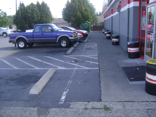 Before photo showing degraded parking lot