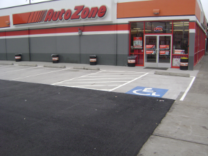 Storefront with repaired asphalt drive lanes